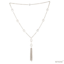 Load image into Gallery viewer, "Anila" refers to wind or air in Sanskrit. "Anila" features a solid sterling silver necklace with gorgeous white freshwater pearls finished with a pendant tassle. Contemporary in design with breathe taking lightness and simplicity. Wear yours with a low necked top.