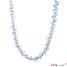 Load image into Gallery viewer, Delicate freshwater water pearls woven into satin ribbon for a royal yet dainty effect. This piece measures 12" around the neck and has 4" ribbon tie on each side.