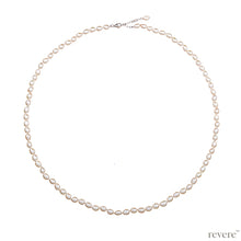 Load image into Gallery viewer, Necklace features freshwater white pearl hand-knotted, elongated necklace with sterling silver extendable chain. A most gorgeous look guaranteed with any outfit.
