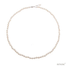 Load image into Gallery viewer, Necklace features freshwater white pearl hand-knotted, elongated necklace with sterling silver extendable chain. A most gorgeous look guaranteed with any outfit.
