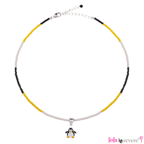 Children's silver penguin pendant delicately suspended on a string of black,yellow and white glass crystals. 