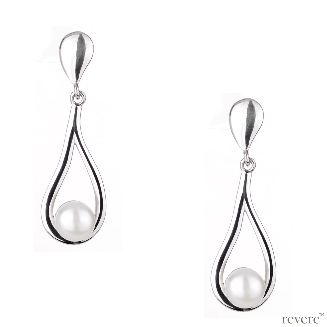 Prominent earrings shaped in a sterling silver drop embellished with white freshwater pearl.