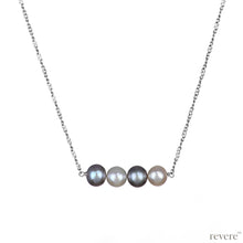 Load image into Gallery viewer, "Moonbeam" features white and grey freshwater pearls secured on a delicate sterling silver chain with rhodium plating. Subtle yet sophisticated.