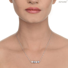 Load image into Gallery viewer, "Moonbeam" features white and grey freshwater pearls secured on a delicate sterling silver chain with rhodium plating. Subtle yet sophisticated.