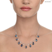 Load image into Gallery viewer, Effervescent blue crystal weaved together with freshwater white pearls as a beautiful statement necklace. "Verve" is sure to be the fun accessory in any gathering!