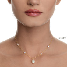 Load image into Gallery viewer, "Noblesse" features white freshwater pearls scattered on a sterling silver chain with 18k gold plating with one white drop pearl. Inspired by the Art Deco movement, this design is delicate yet impactful.
