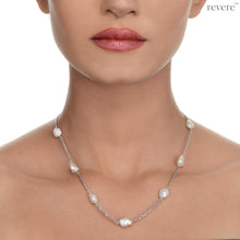 Load image into Gallery viewer, Gaia features gorgeous white freshwater keshi pearls scattered on a sterling silver chain (rhodium plated). Keshi pearls are irregular shaped pearls with character and sheen. This earthy design is subtle and can be styled with any casual look.
