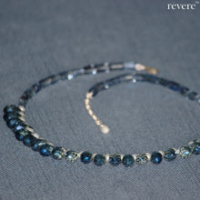 Load image into Gallery viewer, Sparkling blue crystal weaved together with freshwater white pearls as a beautiful statement necklace with a sterling silver adjustable chain.