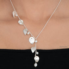 Load image into Gallery viewer, "Harmony" features scratch design sterling silver leaves with white freshwater pearls transformed into an elegant branch. Sure to enhance any outfit anytime of the day!