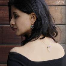 Load image into Gallery viewer, "Motley" necklace features quartz crystal pendant on a gold plated sterling silver chain embellished with white pearl, malachite, lapis lazuli and Taiwanese coral. Pair this with any outfit to look more sensuous.