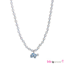 Load image into Gallery viewer, White freshwater pearls handknotted with blue thread with a blue and white tortoise pendant delicately suspended. Add some blue to any outfit.The necklace measures 14&quot; with an adjustable chain of 2&quot; to increase length to 16&quot;.
