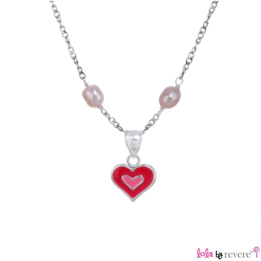 Sterling silver pink heart shaped pendant on a sterling silver chain scattered with baby pink pearls. Ideal for any little girl who loves pink.