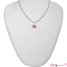 Load image into Gallery viewer, White pearls handknotted in red thread to perfectly compliment the red and white sheep pendant in sterling silver. Measures 14&quot; with an adjustable chain of 2&quot; to increase length to 16&quot;. Pretty and fun!
