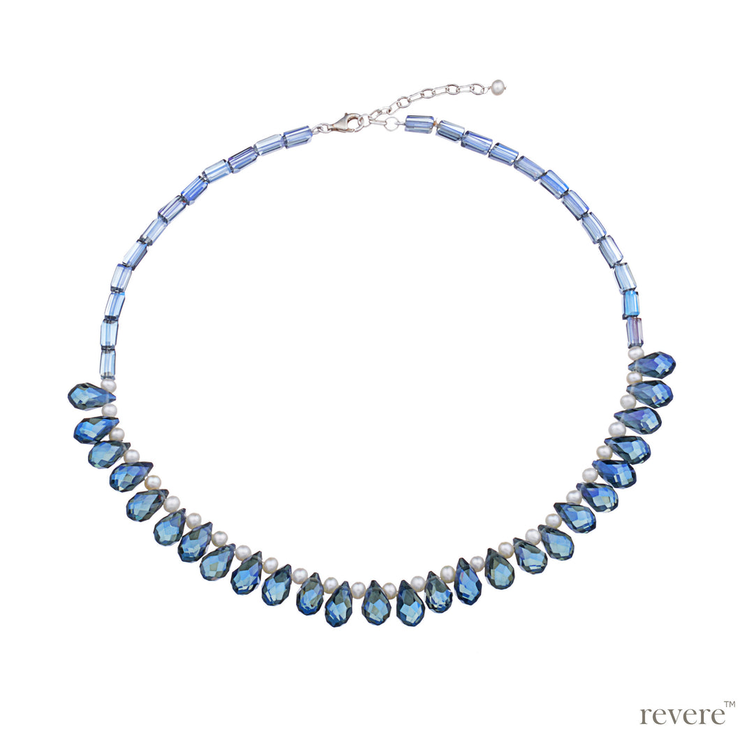Sparkling blue crystal weaved together with freshwater white pearls as a beautiful statement necklace with sterling silver adjustable chain. Sure to be the fun accessory in any gathering! 