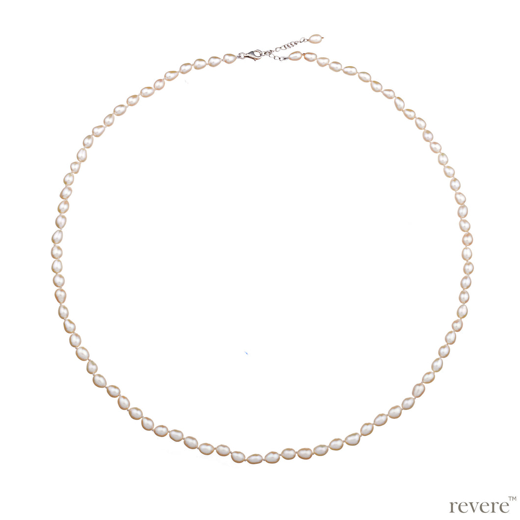 Necklace features freshwater white pearl hand-knotted, elongated necklace with sterling silver extendable chain. A most gorgeous look guaranteed with any outfit.