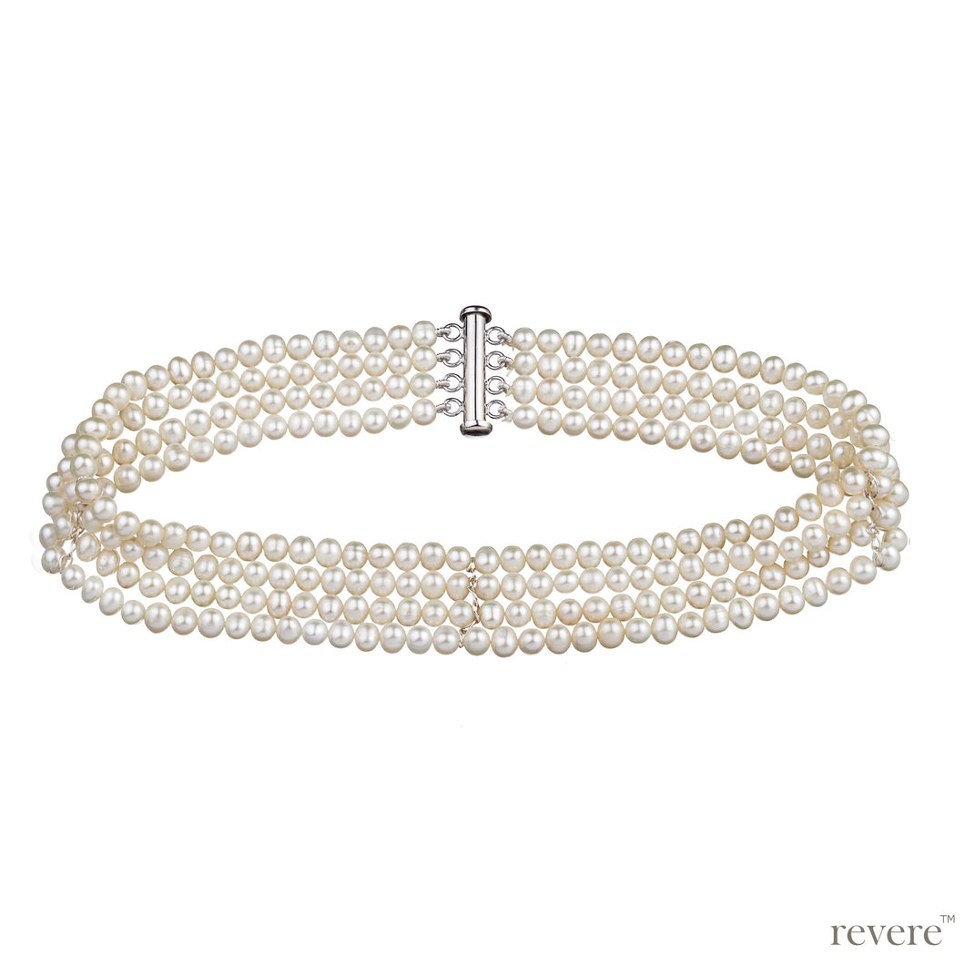 Regalia features multiple strands of hand selected white freshwater pearls. The pearl choker is a timeless classic. 