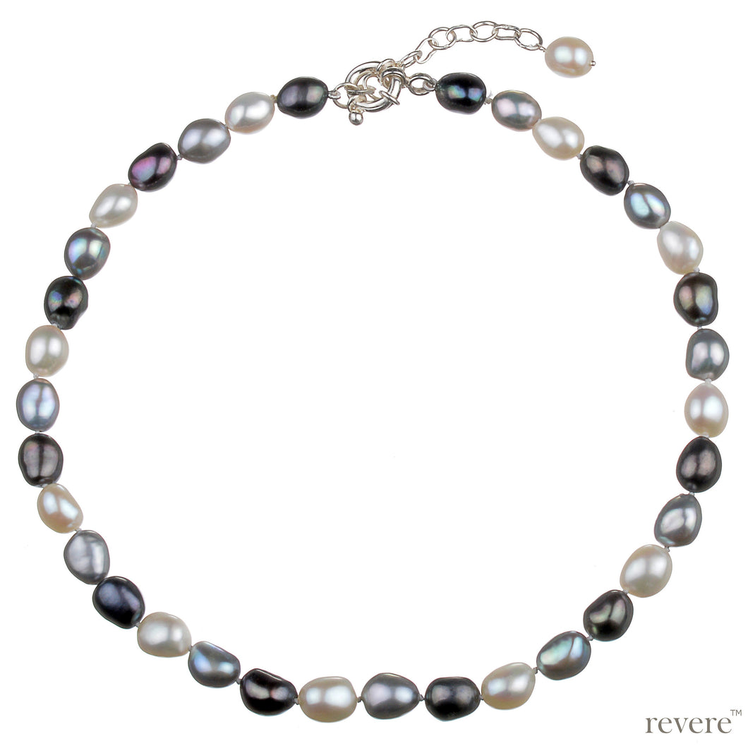 An eye catching piece hand crafted out of high lustre baroque pearls in metallic grey contrasted with warm whites, fastened by a sterling silver clasp with a 2 inch adjustable chain.