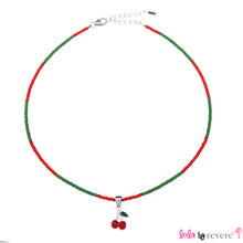 Load image into Gallery viewer, Children&#39;s silver cherry pendant beautifully suspended from a string of green and red glass crystals with an adjustable.
