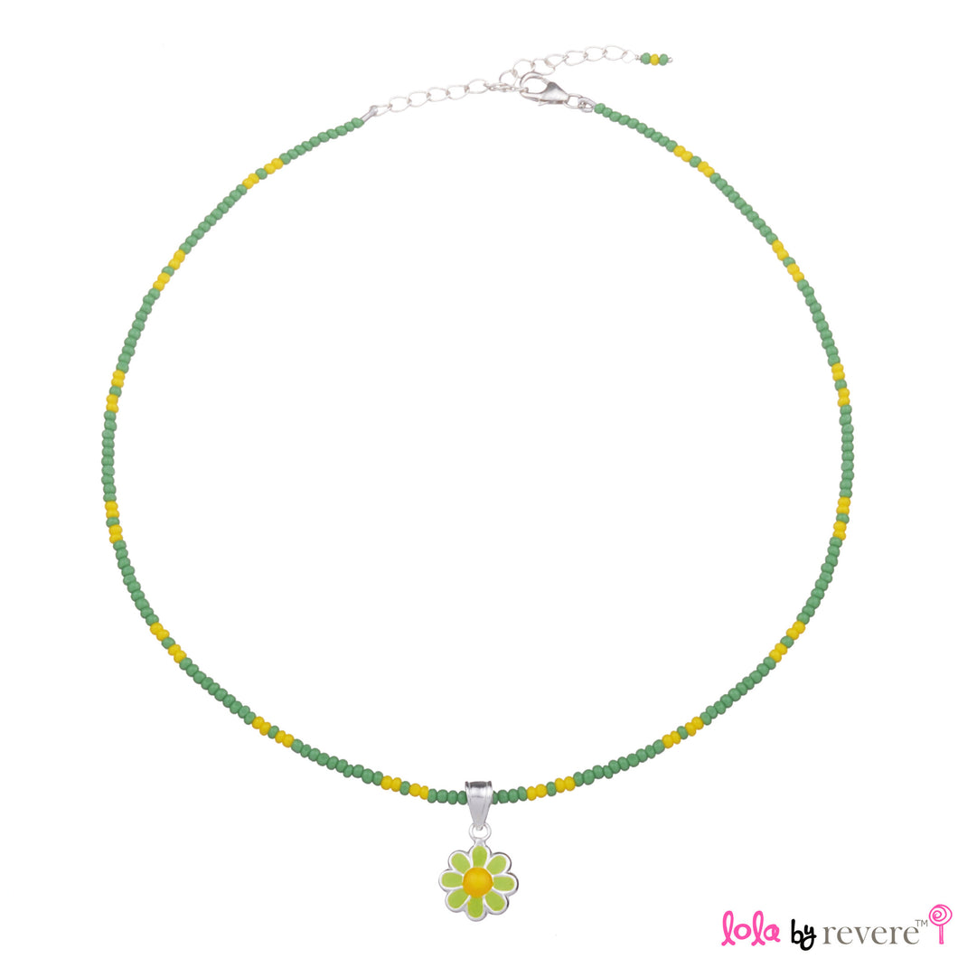 Children's silver daisy pendant delicately suspended from a string of green and yellow glass crystals with an adjustable in sterling silver.
