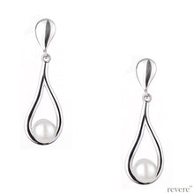 Load image into Gallery viewer, Prominent earrings shaped in a sterling silver drop embellished with white freshwater pearl.
