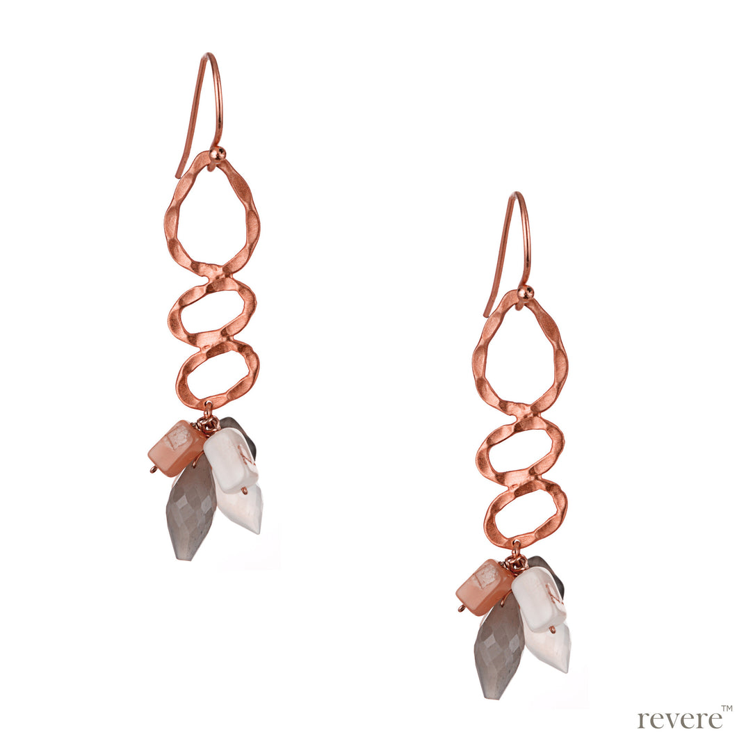 Indulged in fine rose gold tone, earring features with ravishing multi-colored moonstones.
