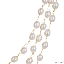 Load image into Gallery viewer, Covet features three strings of delicate white freshwater pearls beautifully threaded on gold cord and fastened by an silver clasp. Elegant, graceful and elaborate, sure to make you feel like a princess.
