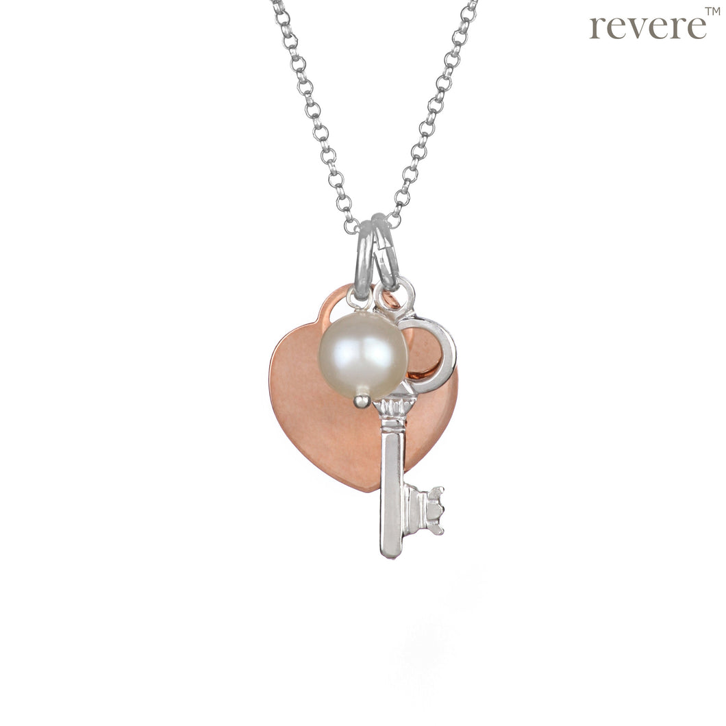 Sterling silver key charm with rose gold plated heart pendant and pearl on a sterling silver chain.