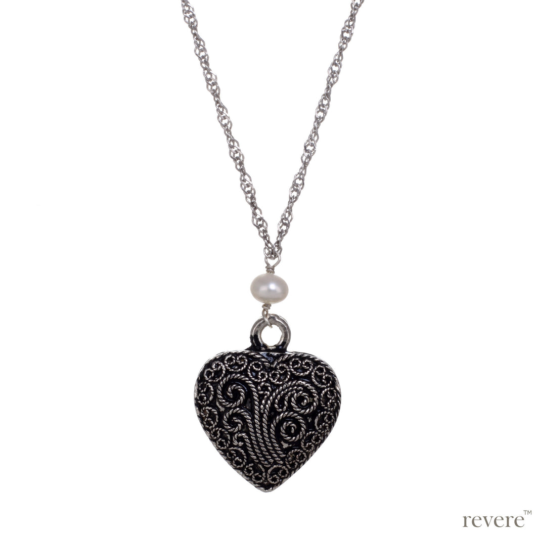 Intense Necklace..depicted by the timeless symbol of love.. a heart..draped on a long beautiful sterling silver chain studded with white pearls.. A timeless classic indeed.