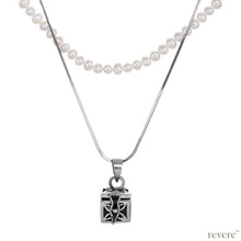 Load image into Gallery viewer, Dive into the magical temptation of this stunning Budhhist box pendant in attractive design made of sterling silver.The neckpiece features a 2 strand design, one strand of white pearls and a second of sterling silver chain and a beautiful Budhhist pendant in sterling silver.
