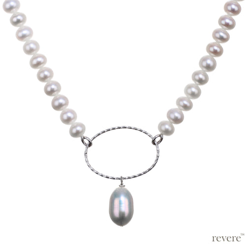 Ecru is a chic strand of freshwater white pearls strung together with a sterling silver oval ring and pearl drop for that extra bit of pop.