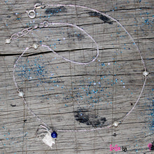 Load image into Gallery viewer, Sterling Silver Chain with two overlapping delicate fish on a sterling silver pendant embellished with small freshwater white pearls and lapis lazuli representing the colours of the sea. The chain measures 14&quot; with an adjustable chain of 1&quot; to increase length to 15&quot;.
