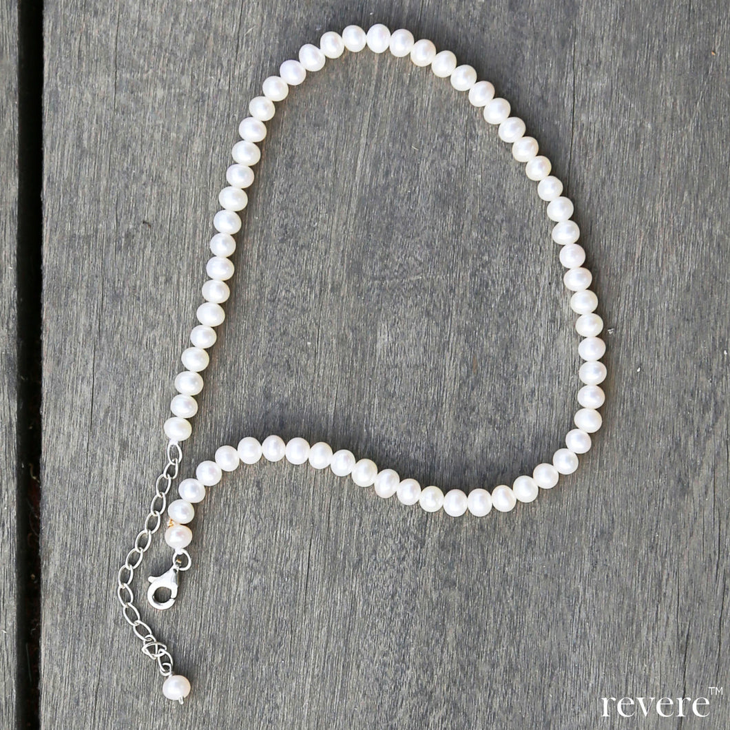 nuovo anklet in white AAA grade cultured fresh water pearls with a sterling silver chain. Perfect to wear with indian wear and western wear, high heels and leather boots.