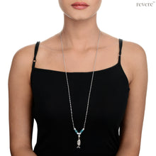 Load image into Gallery viewer, An elegantly hand crafted sterling silver pendant of a fish decorated with pearl and aventurine gemstone on a long sterling silver chain, makes up the &quot;Seine&quot; necklace. 
