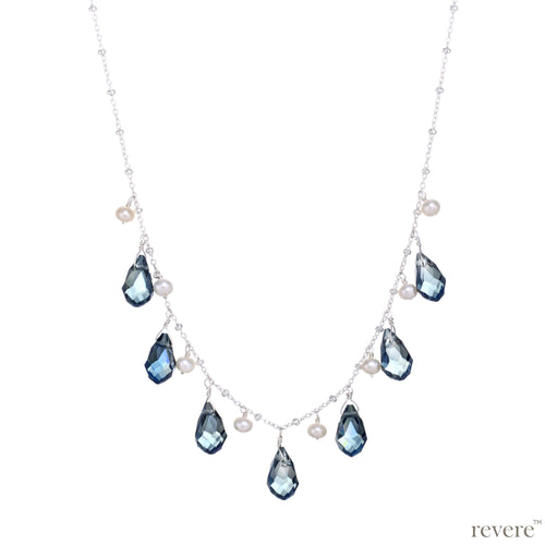 Effervescent blue crystal weaved together with freshwater white pearls as a beautiful statement necklace. 