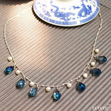 Load image into Gallery viewer, Effervescent blue crystal weaved together with freshwater white pearls as a beautiful statement necklace. &quot;Verve&quot; is sure to be the fun accessory in any gathering! 
